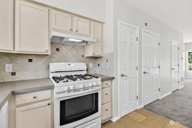 Kitchen with new Countertops, Refrigerator and Dishwasher. Tile back splash