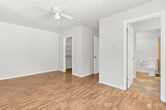 Primary Bedroom with view of walk-in closet and ensuite bathroom entry