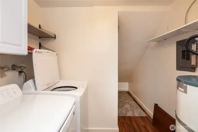 Full size washer and dryer off kitchen.