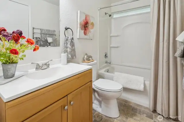 Upper level full bath with door to primary bdrm-new toilet, paint & light fixture