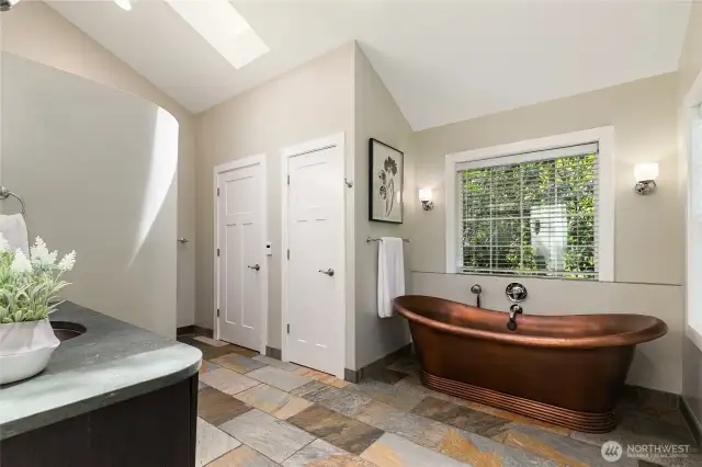 Copper tub and sink. Radiant floor heating. Plus, large tile walk-in shower.
