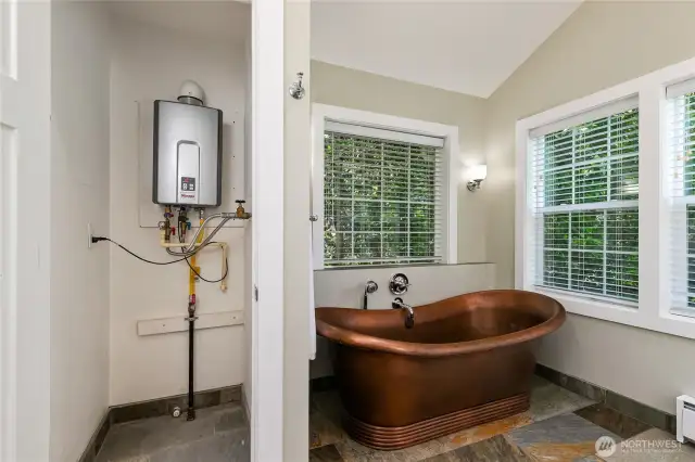 Primary bath with its own tankless water heater.