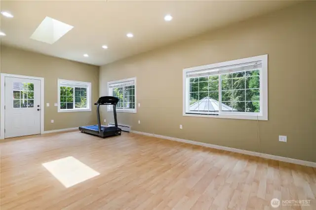 Bonus room attached to the garage. Possible mother-in-law suite or ADU with its own entry door. Not in the photo is the other wall with multiple closet space.