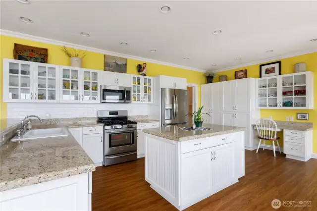 ... and spacious center island.  Nice desk area off the right.  There is also an exterior door further to the right