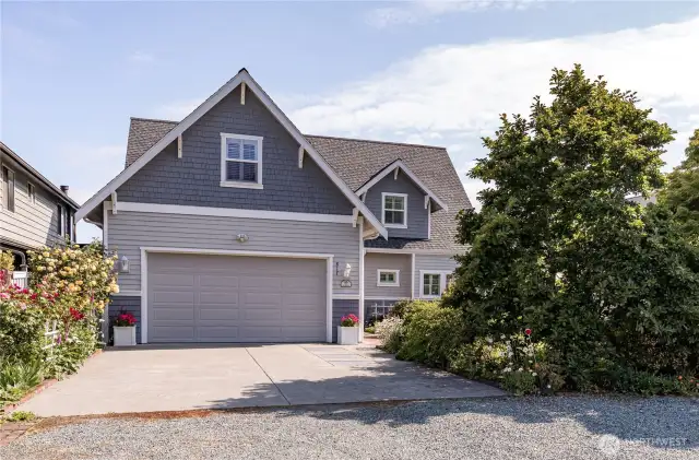Street side of home with 2 car garage.  Beautiful private lot