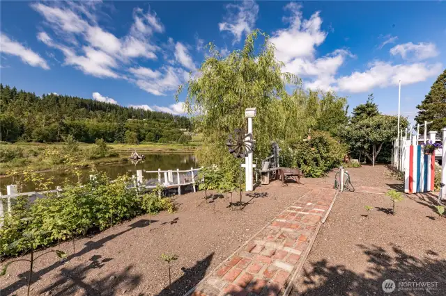 Beautiful space for vegetable garden.  Water on the lot and steps to the lower level and lagoon