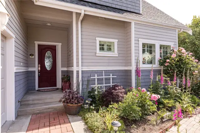 Front entrance with more brick walkways and gorgeous gardens.  Lets go inside and check out this fabulous home