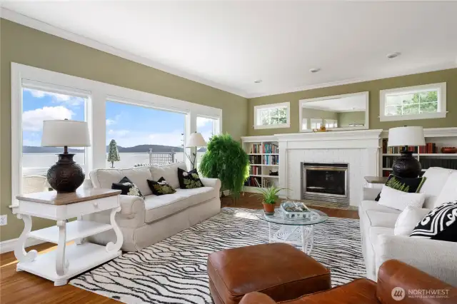 Open Living room with Owner designed fireplace and bookcases.  Lovely View windows.
