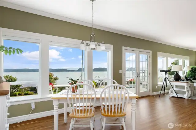 View windows stretch across the entire waterside to capture the breathtaking scenery.  French doors create more connection with the outside.  Deck has built in BBQ bib