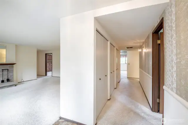 Large Living Room to your left, primary to your right, large hallway with TONS of storage