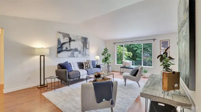 Enjoy quiet nights at home in this open living room with tons of natural light.