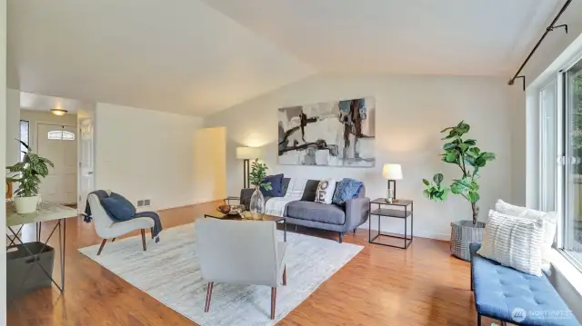 You will love the soaring ceilings and laminate floors in this home with loads of natural light throughout.
