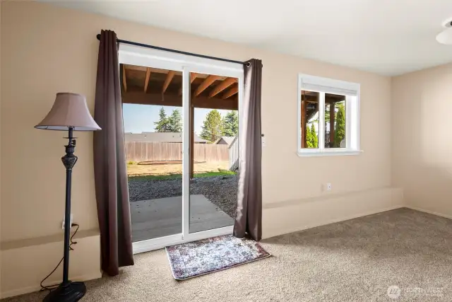 Lower level family room sliding glass doors to patio and backyard.