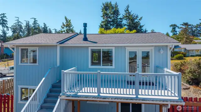 This view gives perspective to the large upper deck and the newly replaced stairs down to the yard.
