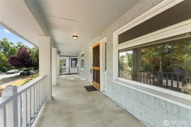The expansive covered porch is ready for your rocking chairs!