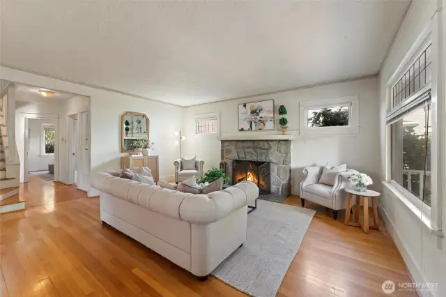 Inside the front door, you'll enter into the large living room with a statement woodburning fireplace