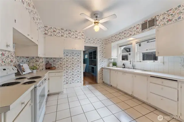 Either embrace the wallpaper and fully functional kitchen, or bring your own vision to modernize this great space.