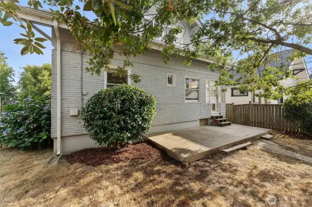 View of the back of the home, from the back of the yard.