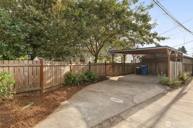 Covered carport, along with alley access.
