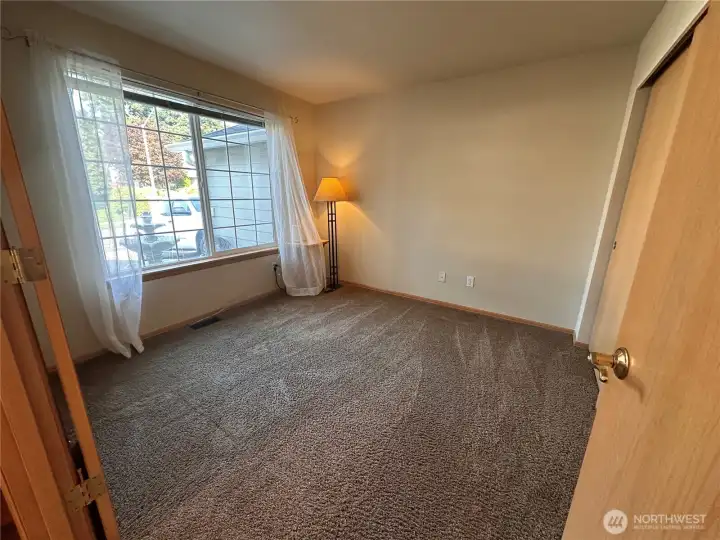 On the main floor off the foyer is a 5th bedroom/office/den (you decided how to use it) with the water fountain outside the window.