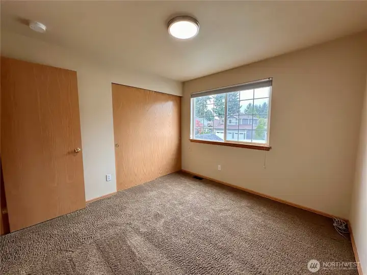 Secondary bedroom on the front side of the house nearest the stairs.