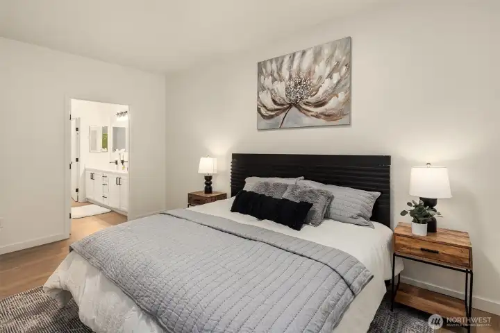 Primary suite has it's own private 3/4 bath with large walk in shower and walk in closet. Dual vanities for ultimate convenience.
