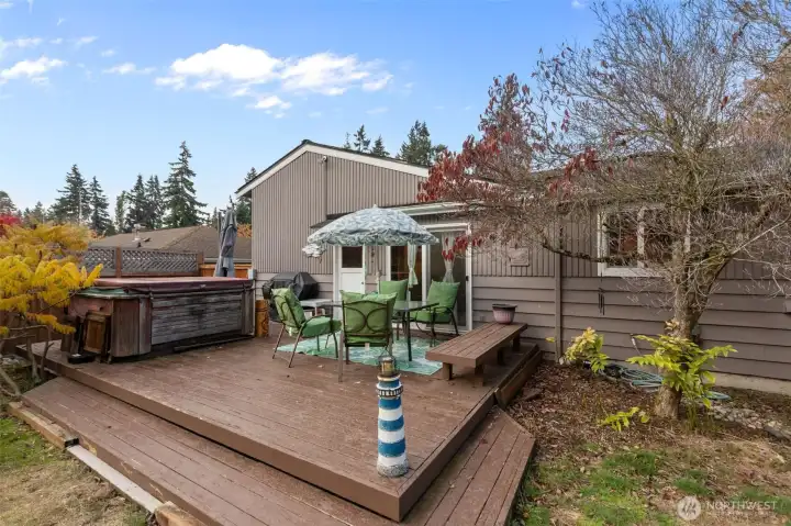 Large Deck w/built-In Bench, Hot Tub to stay with home.  It works great!