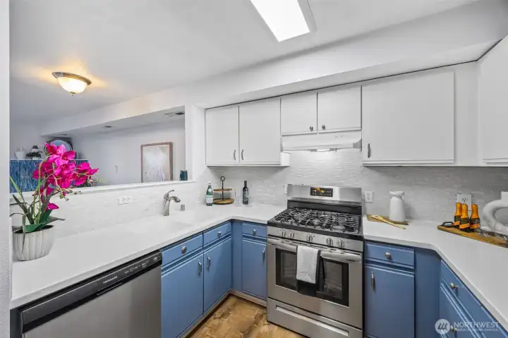 Stainless-steel appliances, updated finishes, and abundant storage deliver both function and style.