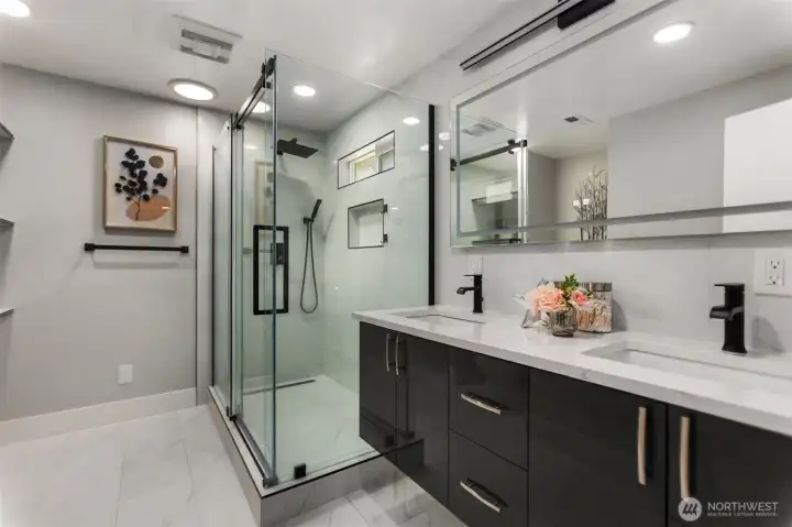 Primary bedroom with ensuite bathroom features a double vanity and large shower for all your needs!