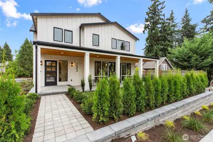 Modern elegance meets farmhouse charm in this newly built retreat. With clean lines, black-framed windows, and a welcoming porch, it’s designed for comfort and connection. Surrounded by lush greenery, it’s a peaceful escape just minutes from everything.