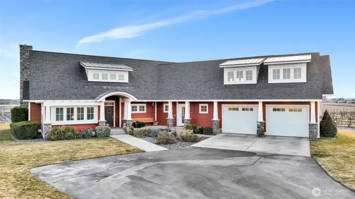 Striking curb appeal welcomes you to this Bruce Preston-built, custom two-story Craftsman home and two-car garage set against wide-open skies and peaceful country surroundings.