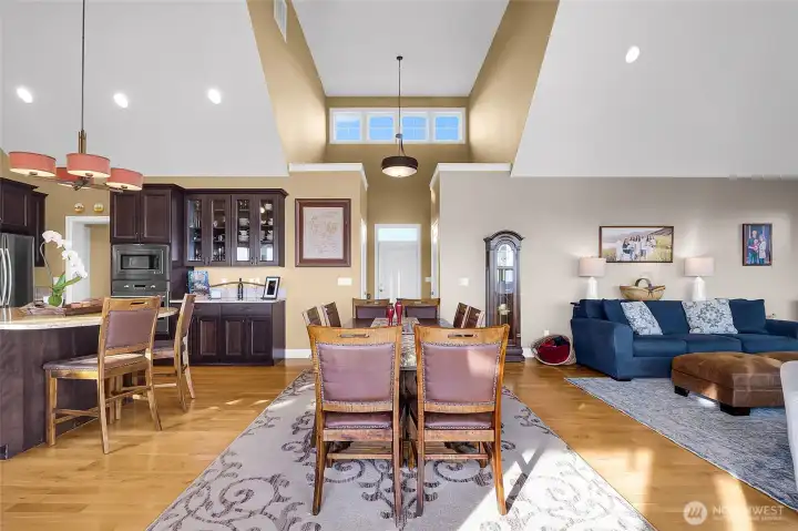 Vaulted ceilings lift the entire space—flooded with light, filled with air, and designed for moments that feel as grand as the home itself.