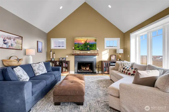 The vaulted ceilings create so much space as you enjoy your fireplace and feast your eyes on the view out in the valley toward the lake.