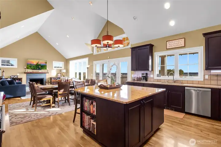 An oversized island invites morning coffee, after-school snacks, and conversations that linger.