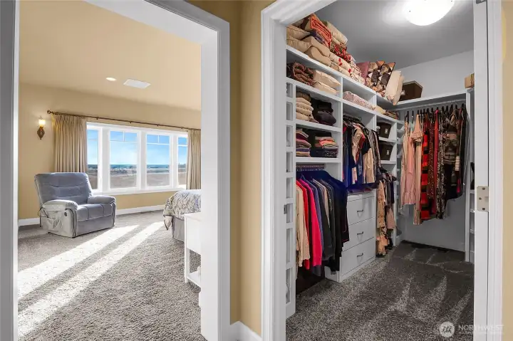 Enter the primary suite at the end of a short hallway as you come in to unwind, put things away, and curl up with a good book in the spaciousness of your bedroom retreat.