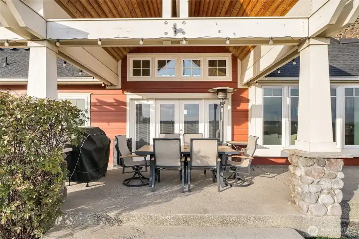 A majestic, covered back patio designed for year-round enjoyment, with sunlight, fresh air, and the quiet of the hilltop—this is what coming home should feel like.