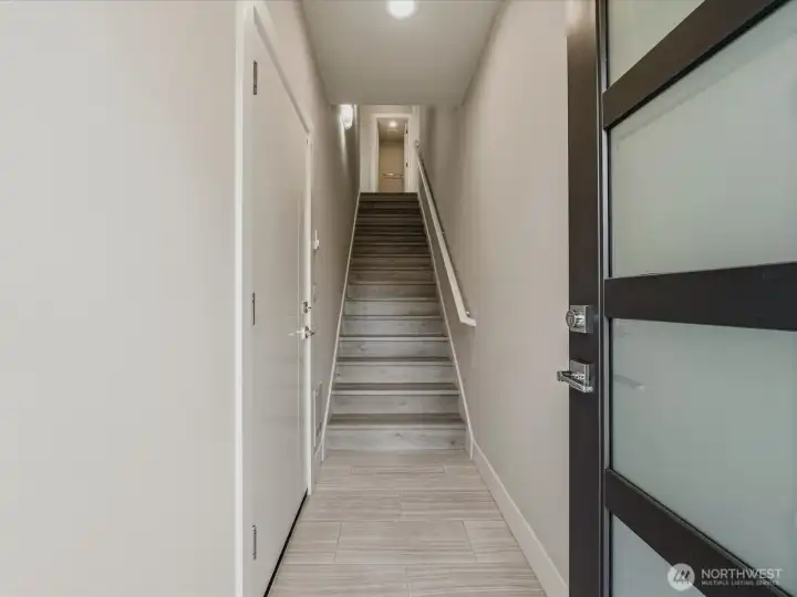 Entry with a 5 panel frosted glass front door