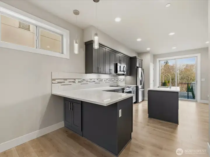 Peninsula supports eating space and counter height bar stools