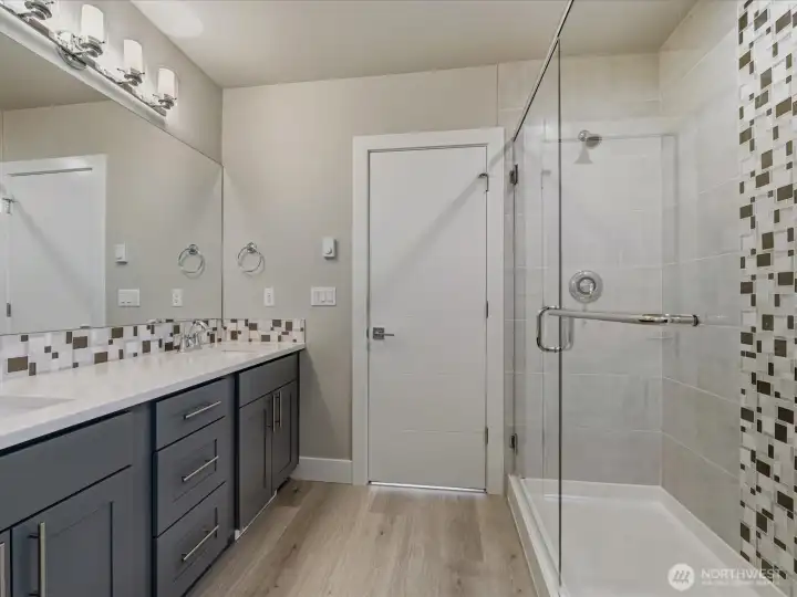 Meticulously maintained and upkept primary bathroom with separate water closet.