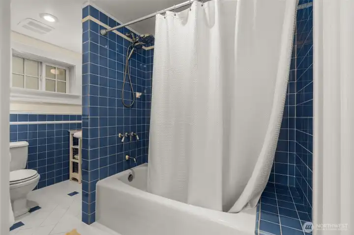 Spacious tile bath on lower level
