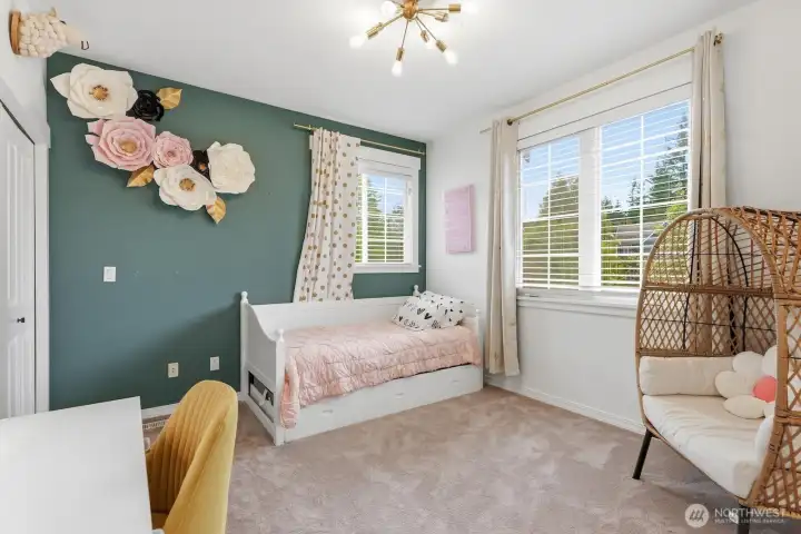 Third upstairs bedroom, looking out to nature and treetops all around.