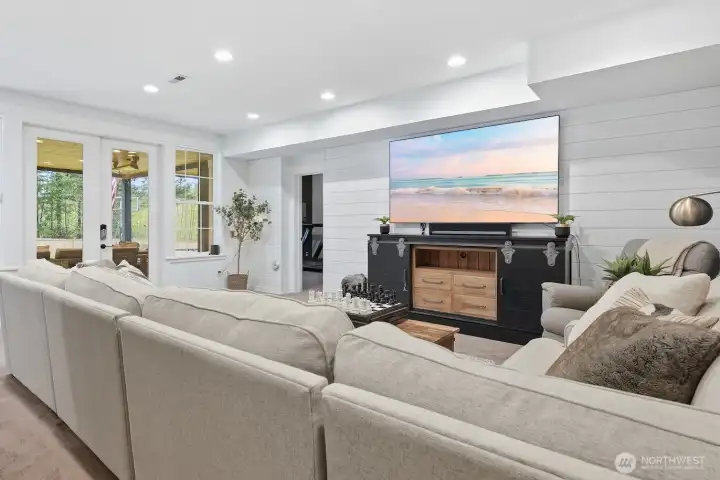 In the daylight basement, even more space awaits - including this awesome rec room!