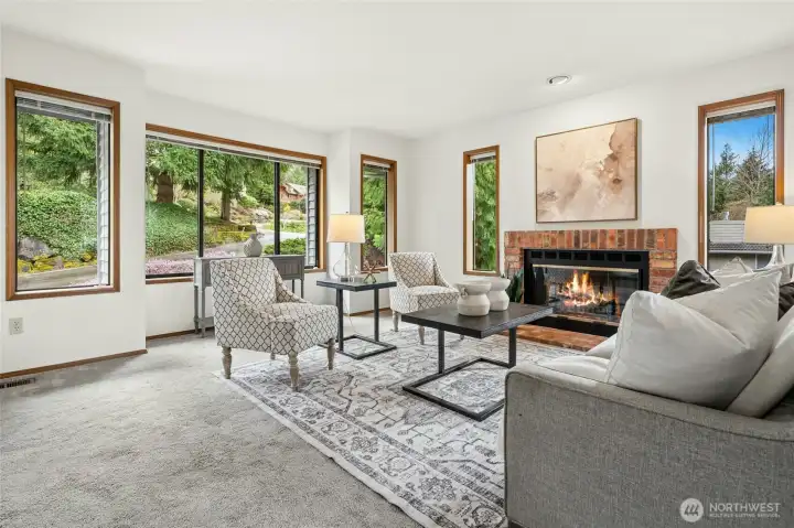 Huge living room off the entry with wood burning fireplace.
