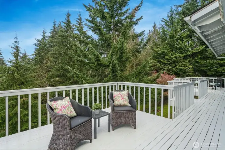 Huge deck spans the length of the home offering quiet outdoor enjoyment.