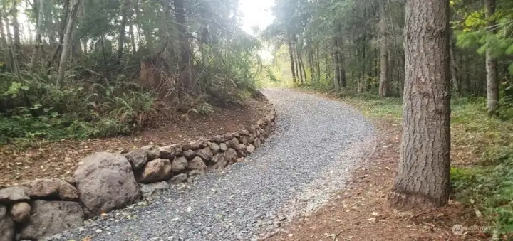 A beautiful rock wall greets you as you crest the access road.