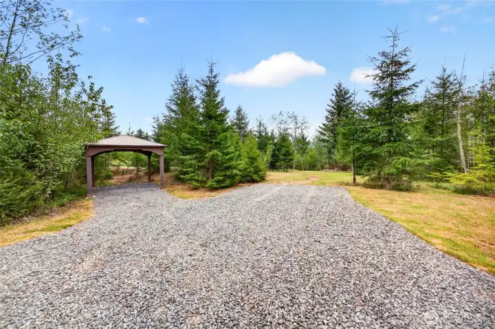 A gazebo is offered on the property to utilize for picnics, covered parking or a shady place to sit and unwind.