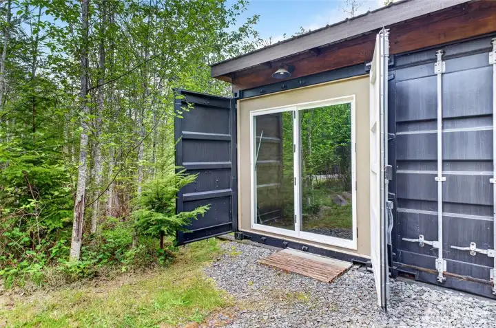 Once opened, the sliding glass door reveals the thoughtful design and vision that went into creating the space.