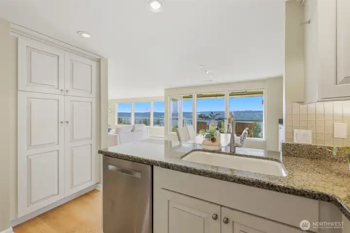 Updated kitchen featuring a newer dishwasher (2023), range (2022), microwave (2025), kitchen faucet (2020), and under-cabinet lighting Updated kitchen featuring a newer dishwasher (2023), range (2022), microwave (2025), kitchen faucet (2020), and under-cabinet lighting