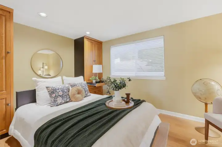 Versatile second bedroom featuring a Murphy bed with a built-in desk — perfect for guests, a home office, or multi-purpose living Versatile second bedroom featuring a Murphy bed with a built-in desk — perfect for guests, a home office, or multi-purpose living