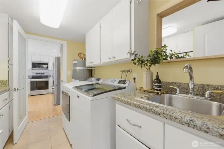 Laundry room with major system updates including water heater (2020), electrical panel (2021), furnace & heat pump (2021), and washer & dryer (2024). Laundry room with major system updates including water heater (2020), electrical panel (2021), furnace & heat pump (2021), and washer & dryer (2024).